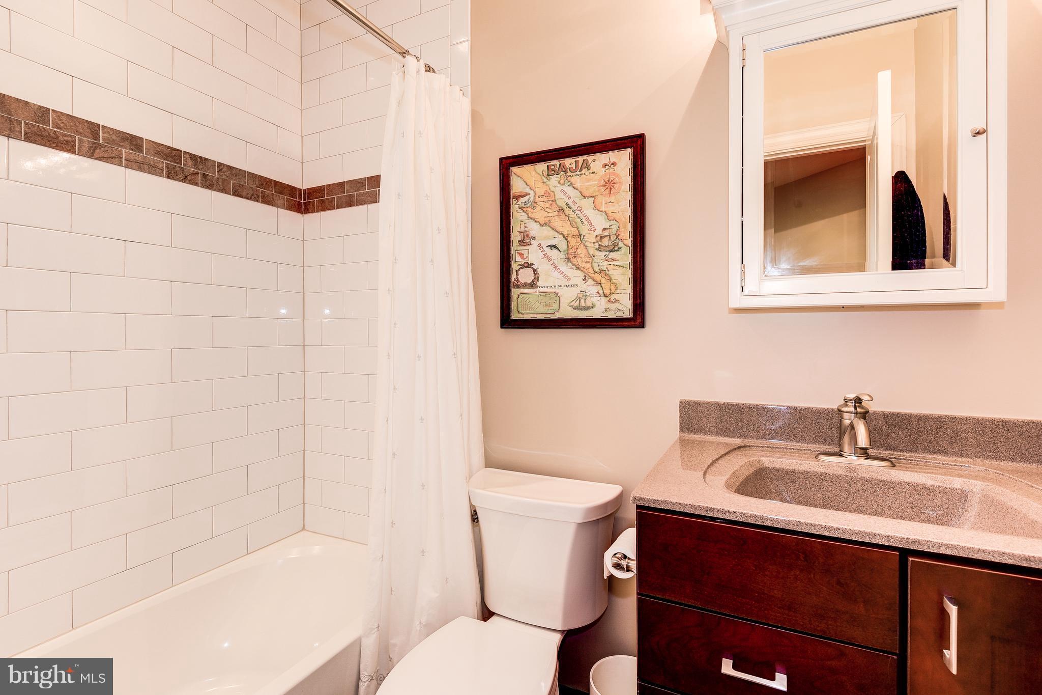 7711 Elmwood Road Fulton, MD 20759 - Photo 26 of 30 Lower level bath with beautiful tile detail