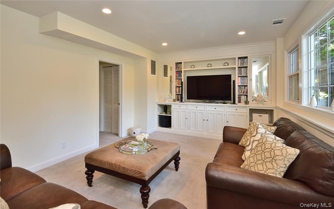 9 Franklin Avenue Rye, NY 10580 - Photo 24 of 35 a living room with furniture and a flat screen tv