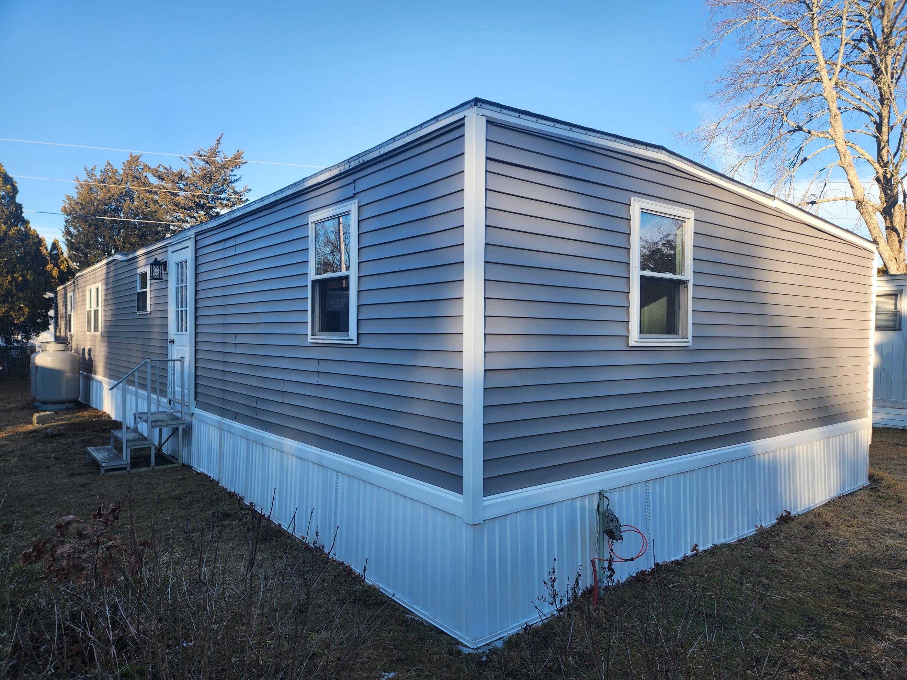 3 4th Avenue Pocasset, MA 02559 - Photo 4 of 23 a view of a house with wooden fence