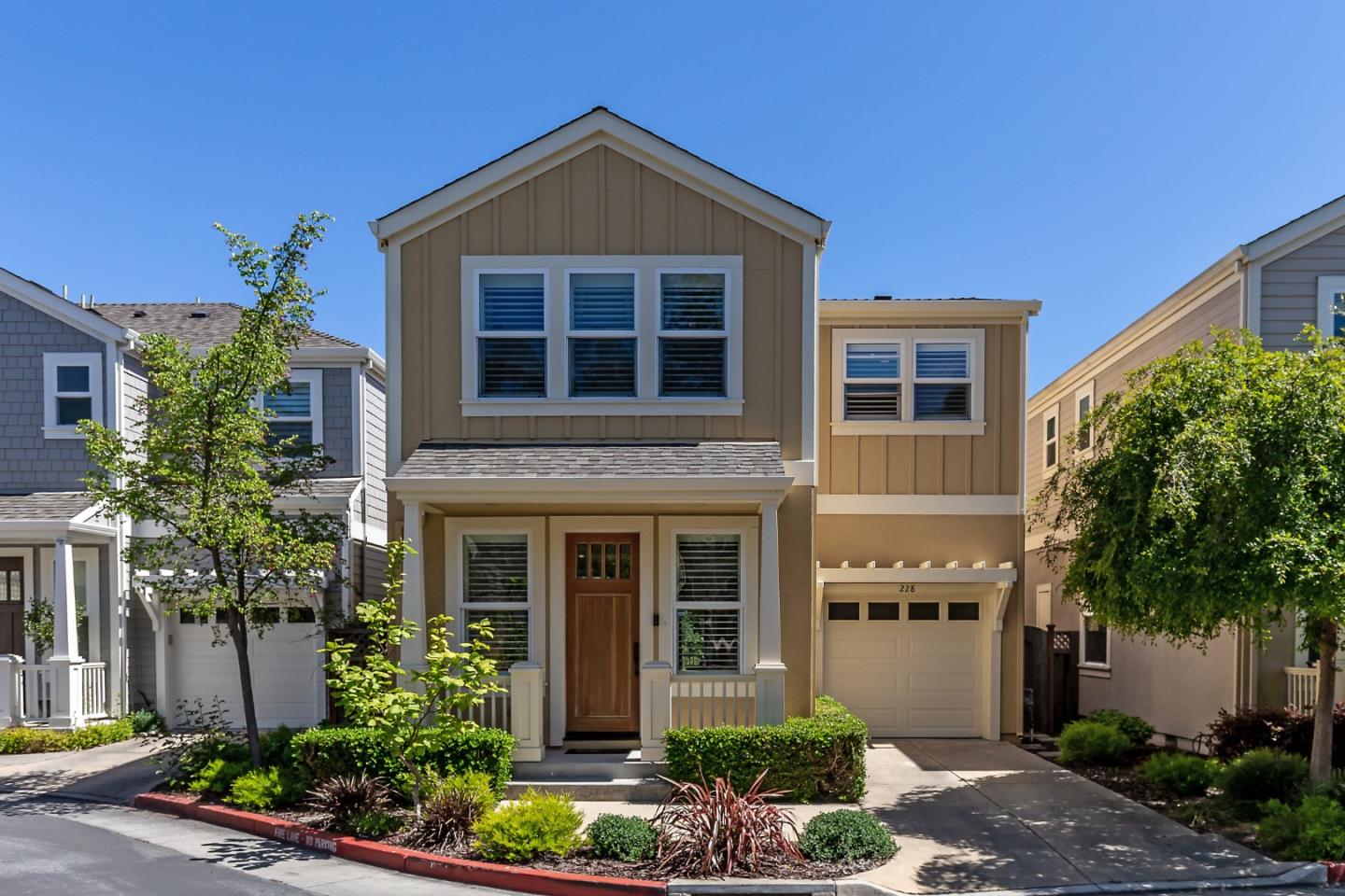 228 Creekside Village Drive Los Gatos, CA 95032 - Photo 1 of 27 a front view of a house with a yard