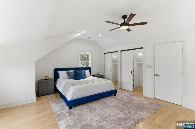 a bedroom with a bed and a dresser