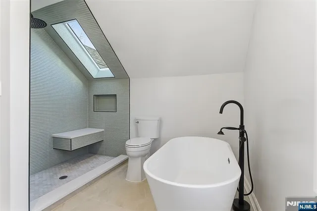 a bathroom with a toilet and a sink