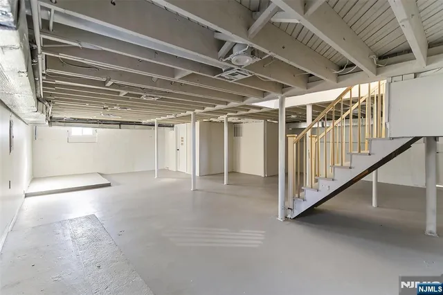 a view of an empty room with stairs