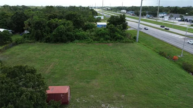 a view of a chairs and table in the garden
