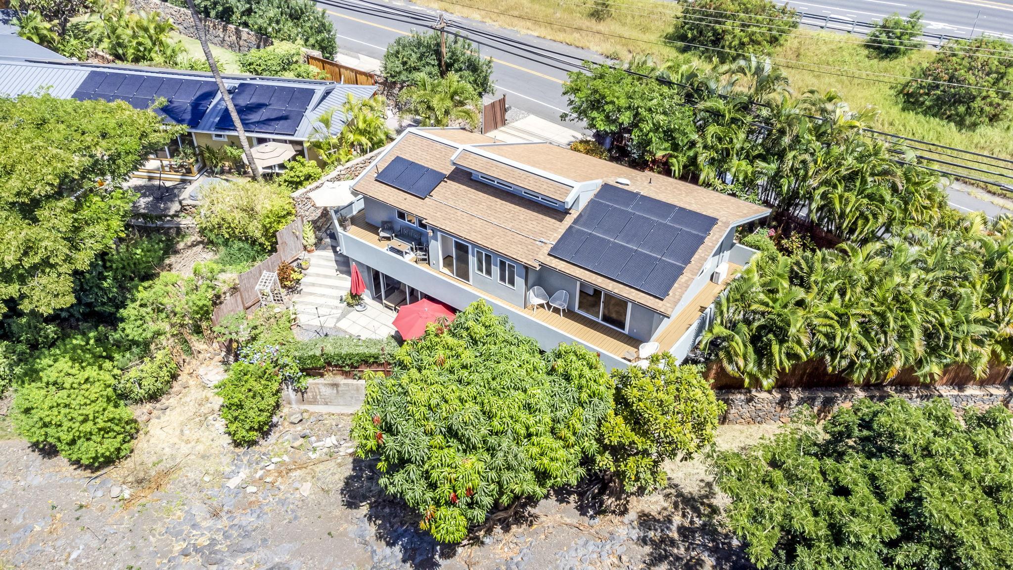 2670 Kanakanui Road Kihei, HI 96753 - Photo 1 of 41 an aerial view of a house with a yard and garden in front of it