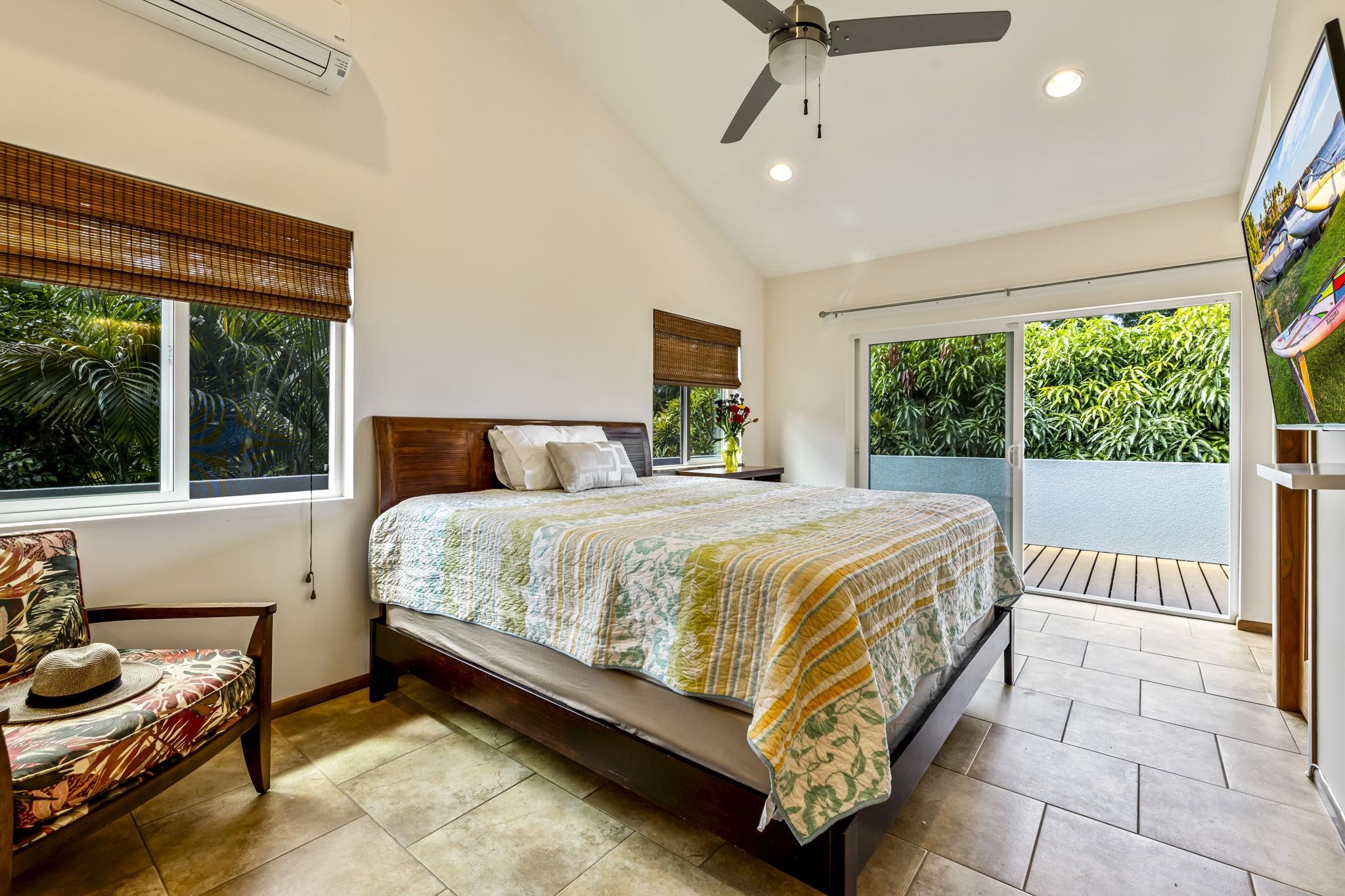 2670 Kanakanui Road Kihei, HI 96753 - Photo 16 of 41 a bed sitting in a spacious bedroom next to a window