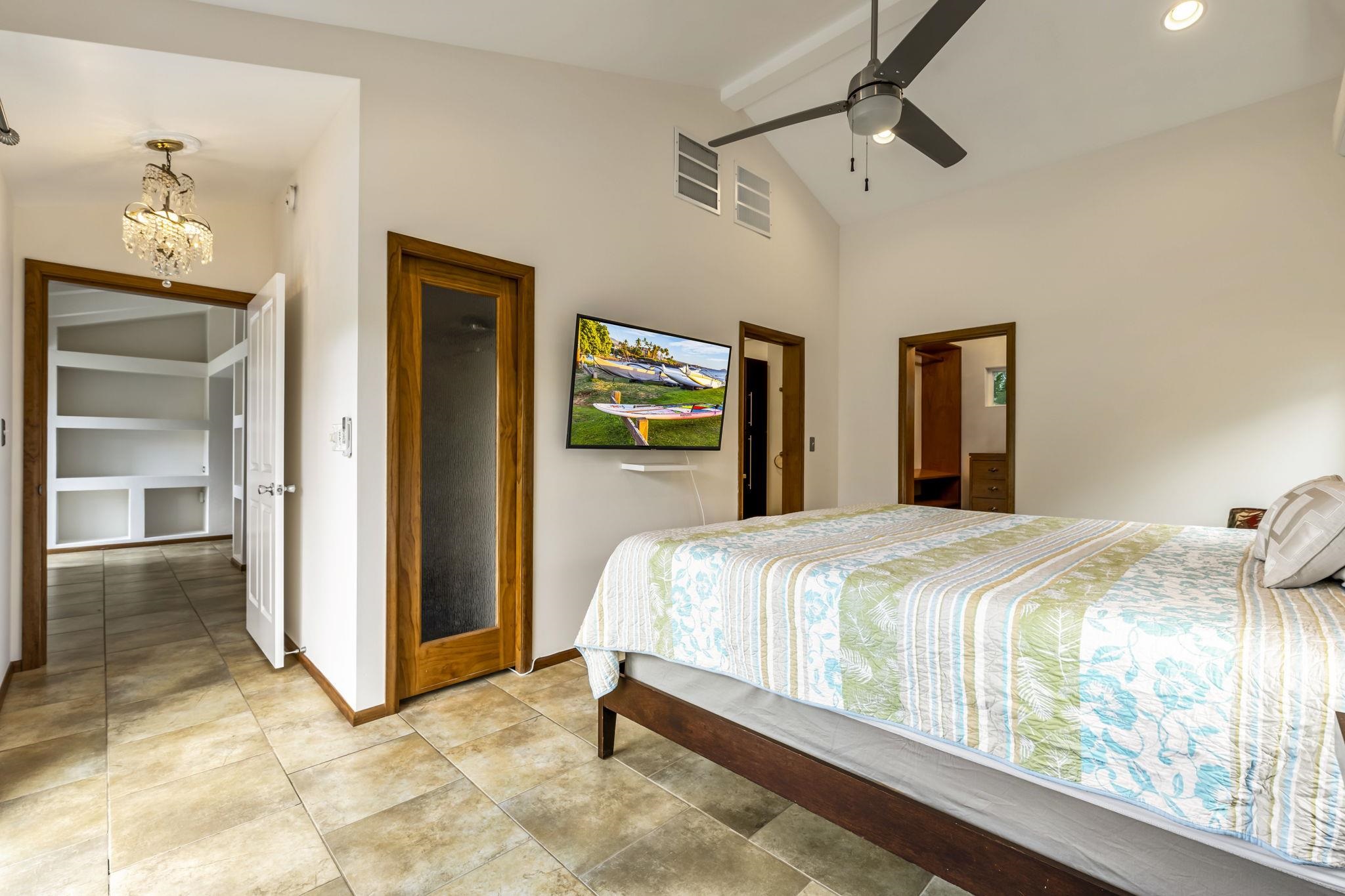 2670 Kanakanui Road Kihei, HI 96753 - Photo 17 of 41 a bedroom with a bed and a dresser