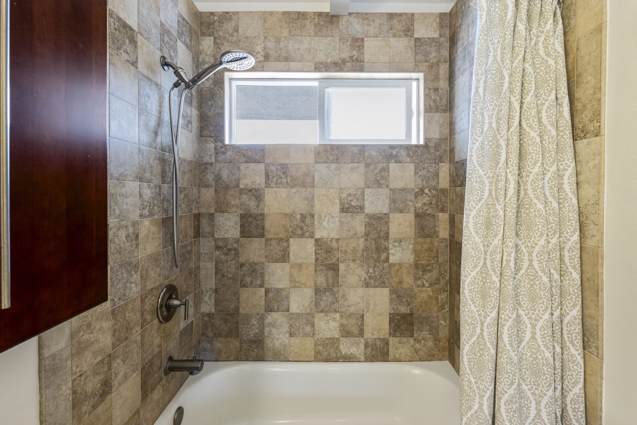 2670 Kanakanui Road Kihei, HI 96753 - Photo 20 of 41 a bathroom with a shower