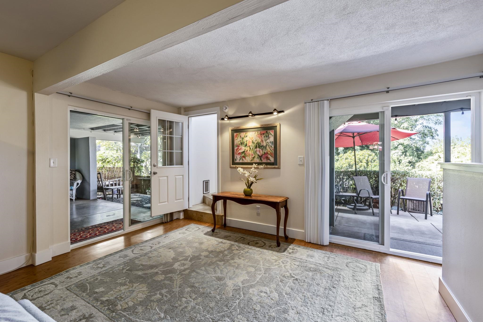 2670 Kanakanui Road Kihei, HI 96753 - Photo 28 of 41 a bedroom with furniture and a gate