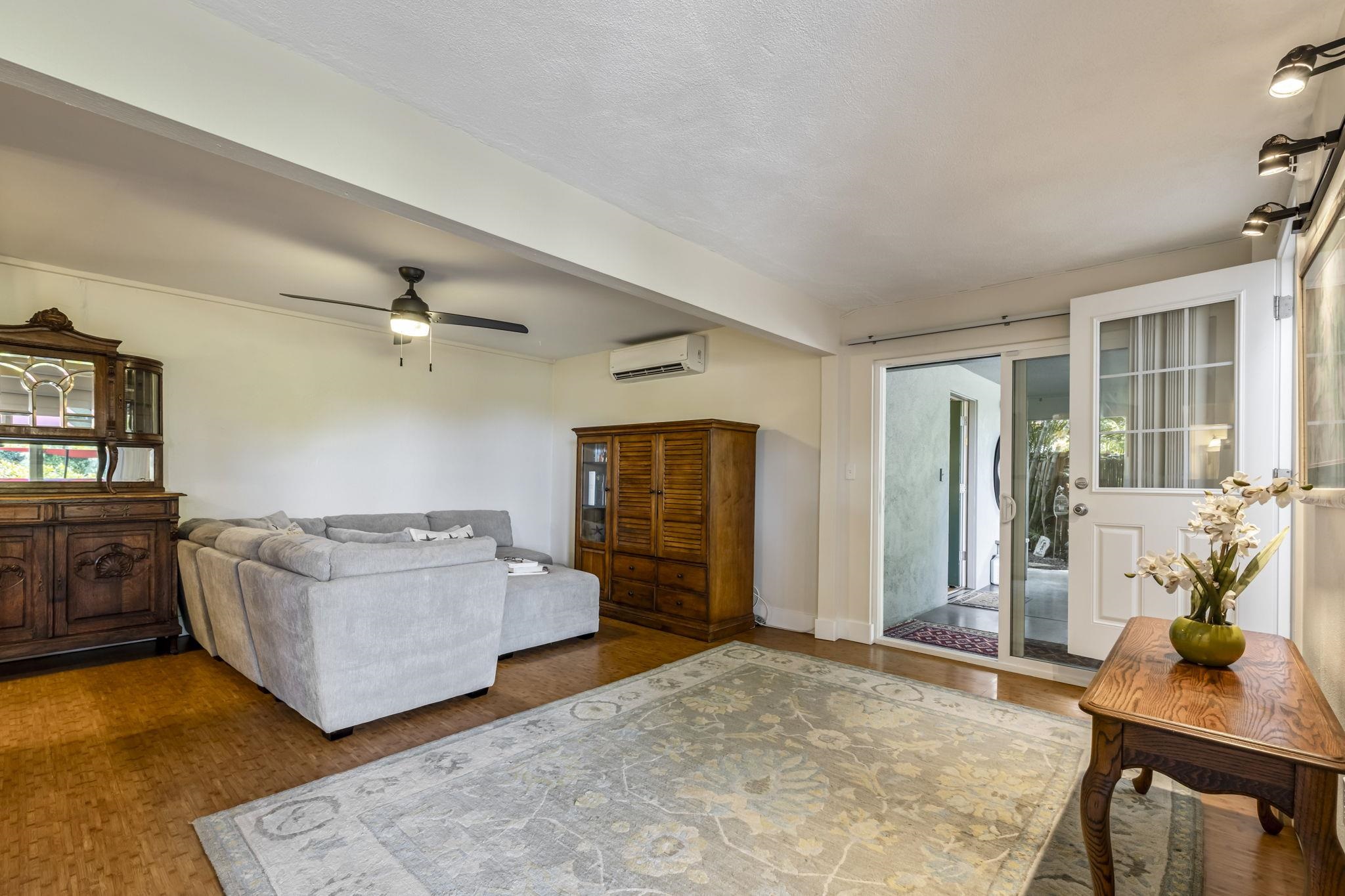 2670 Kanakanui Road Kihei, HI 96753 - Photo 29 of 41 a living room with furniture and a flat screen tv