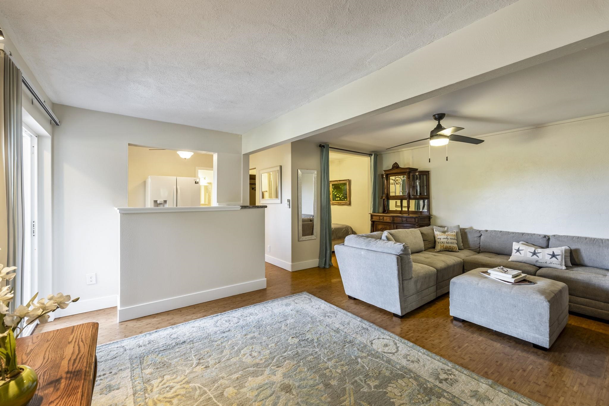 2670 Kanakanui Road Kihei, HI 96753 - Photo 30 of 41 a living room with furniture and a chandelier