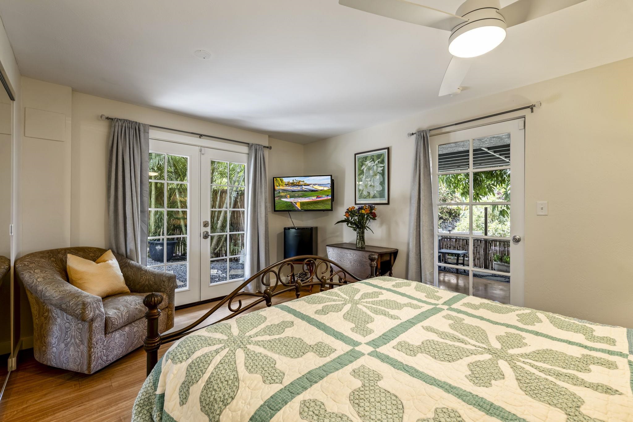2670 Kanakanui Road Kihei, HI 96753 - Photo 32 of 41 a bedroom with furniture and a large window