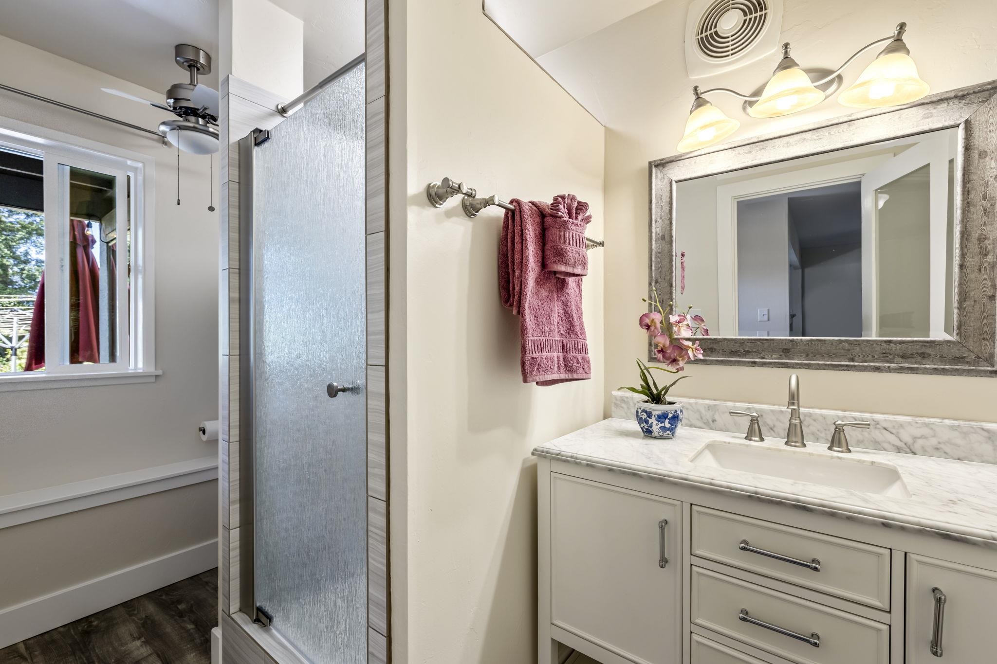 2670 Kanakanui Road Kihei, HI 96753 - Photo 35 of 41 a bathroom with a sink vanity and a mirror