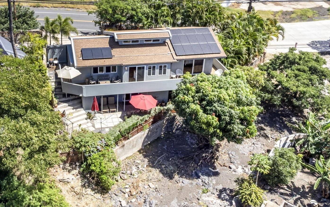 2670 Kanakanui Road Kihei, HI 96753 - Photo 40 of 41 an aerial view of a house with a yard and large trees