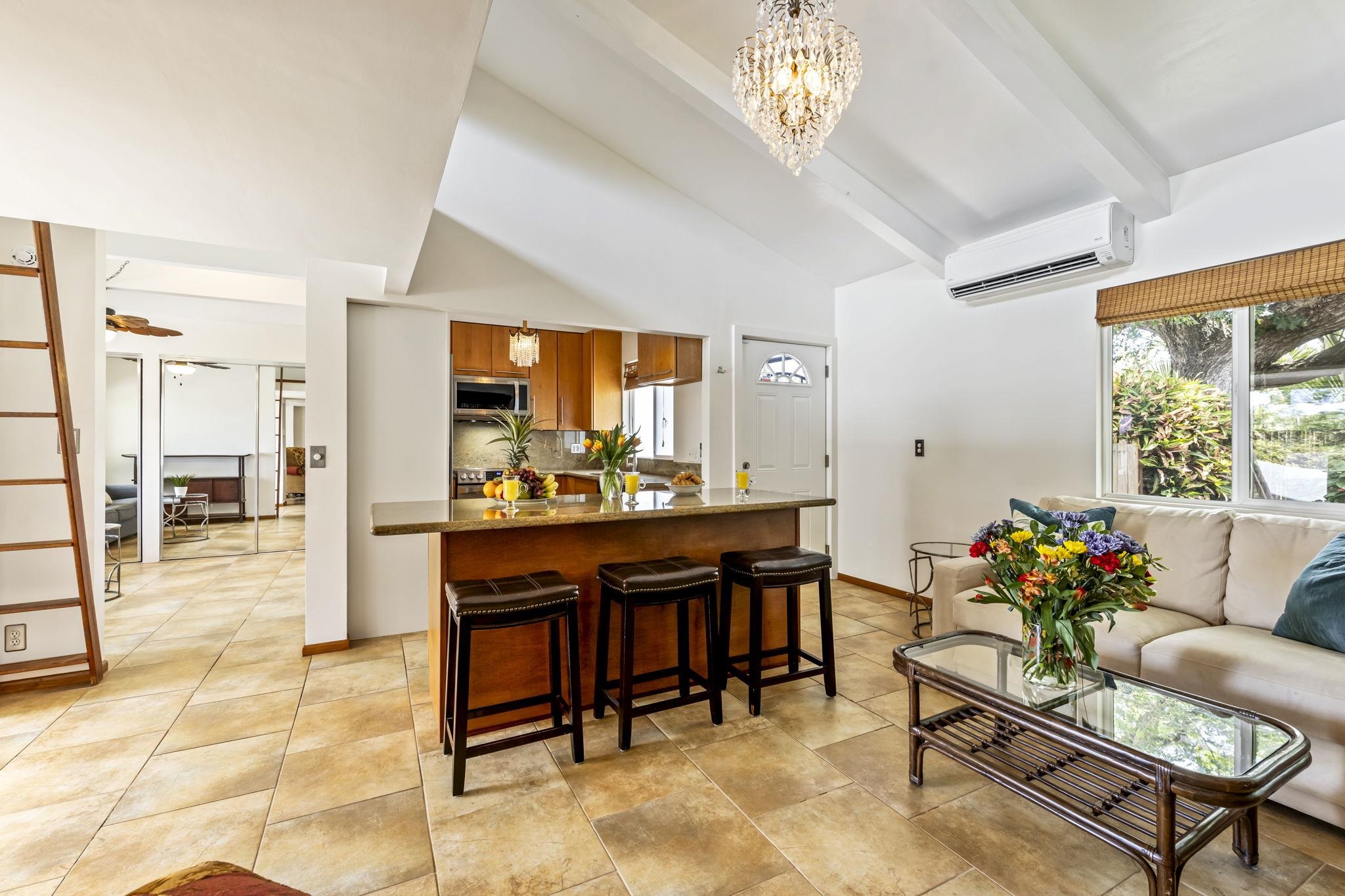 2670 Kanakanui Road Kihei, HI 96753 - Photo 5 of 41 a view of a dining room with furniture and a chandelier