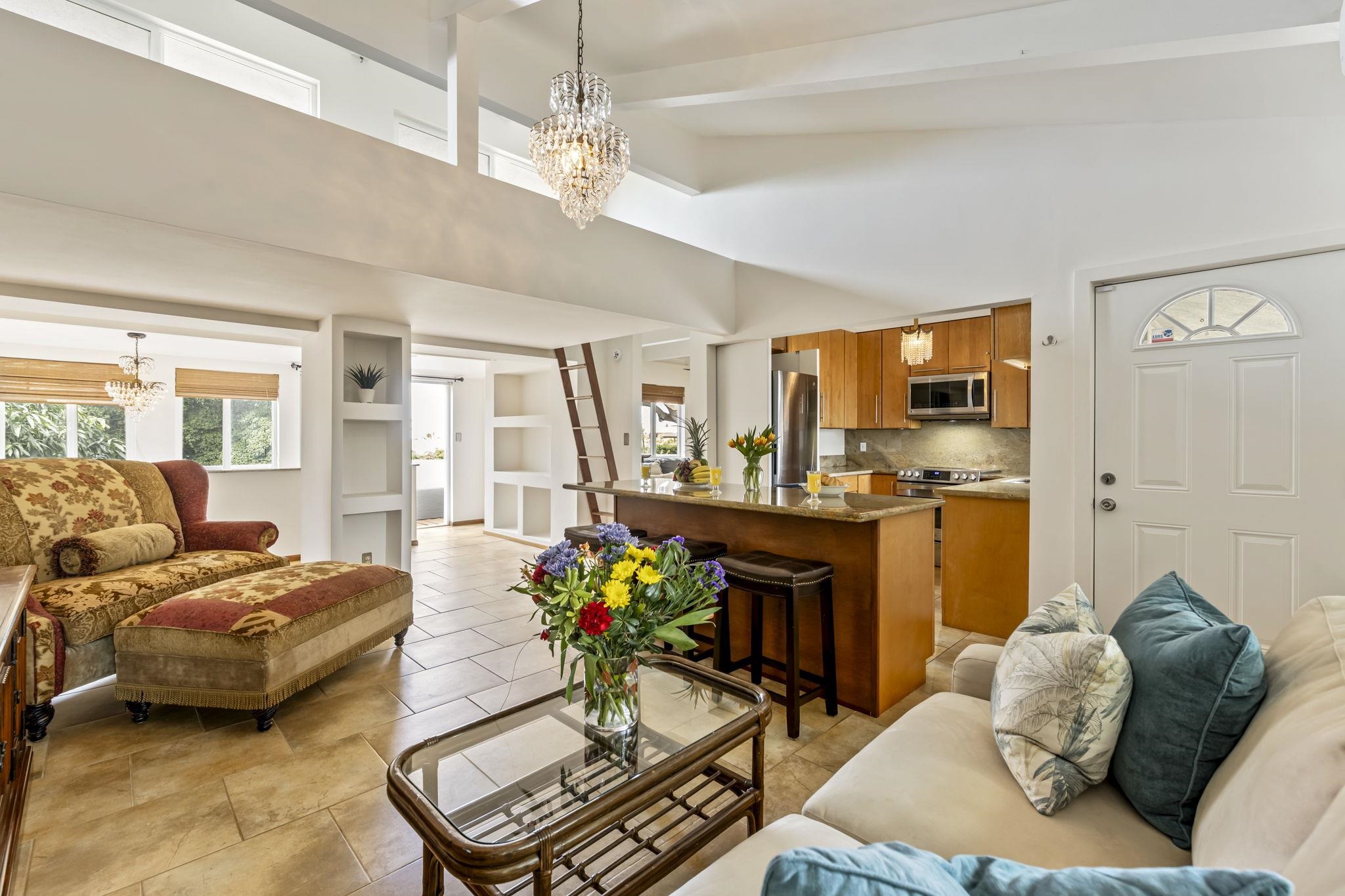 2670 Kanakanui Road Kihei, HI 96753 - Photo 6 of 41 a living room with furniture kitchen and a chandelier