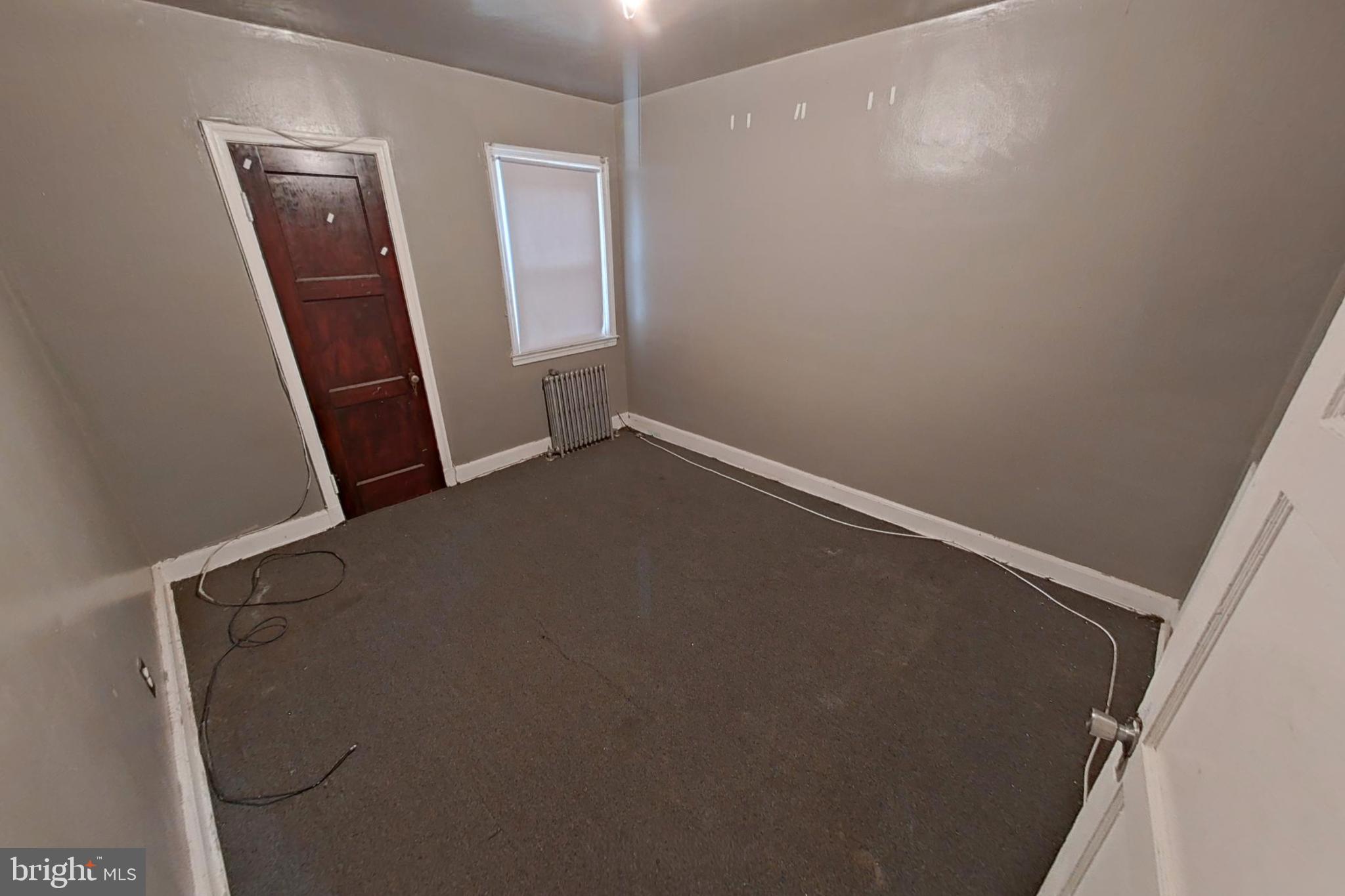 3716 Flowerton Road Baltimore, MD 21229 - Photo 12 of 21 an empty room with a mirror