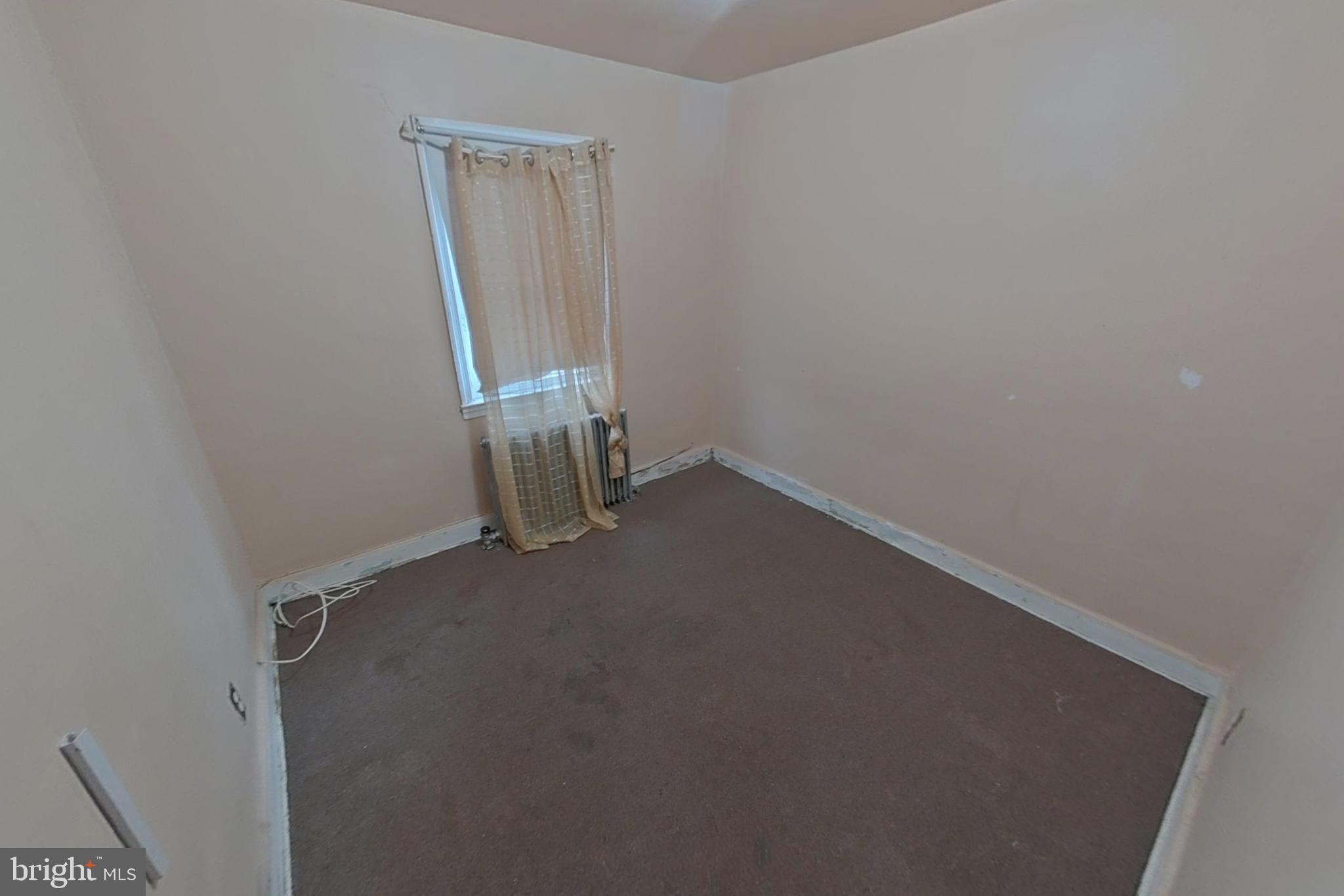 3716 Flowerton Road Baltimore, MD 21229 - Photo 15 of 21 an empty room with a door