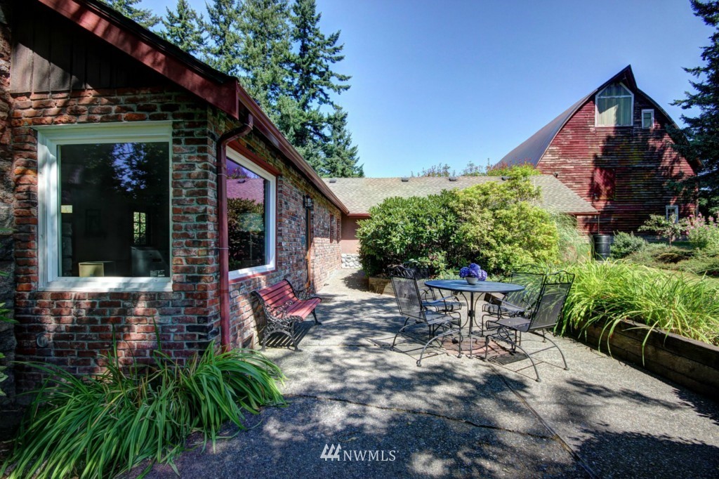 6294 Mission Road Bellingham, WA 98226 - Photo 1 of 25 a view of a chair and table in backyard of the house