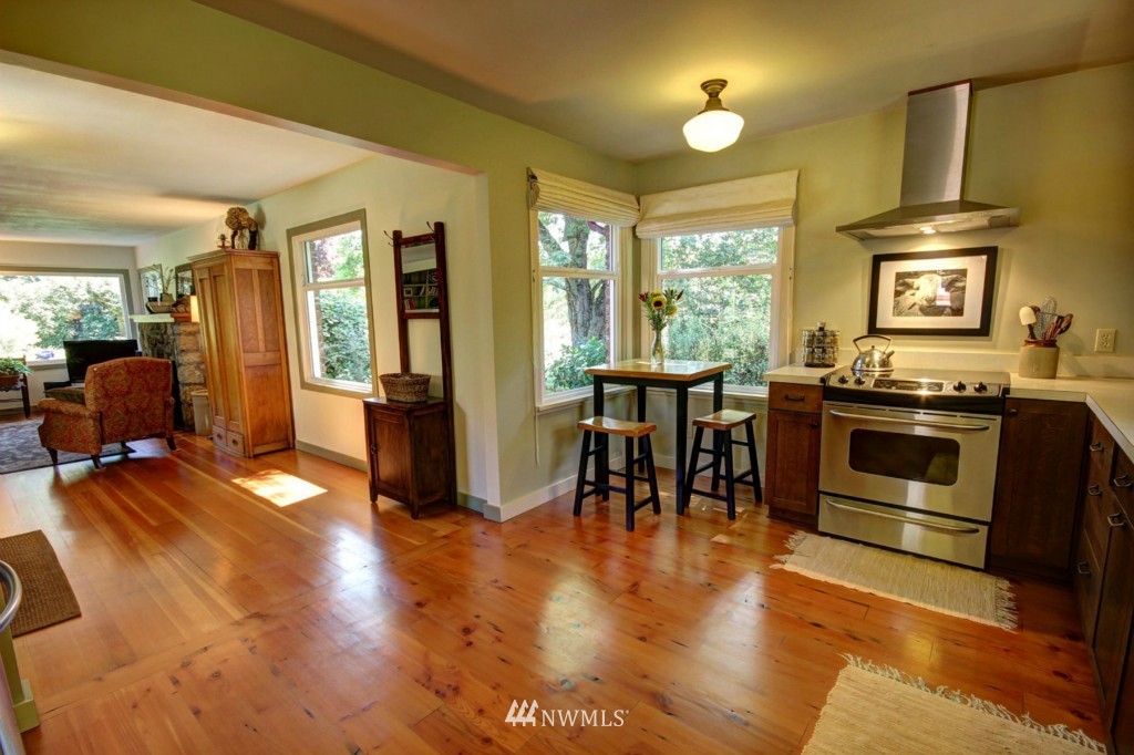 6294 Mission Road Bellingham, WA 98226 - Photo 4 of 25 a view of a kitchen with furniture stove and wooden floor