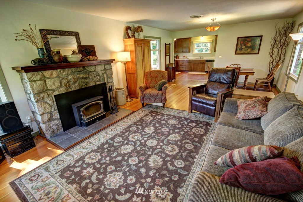 6294 Mission Road Bellingham, WA 98226 - Photo 6 of 25 a living room with furniture and a fireplace