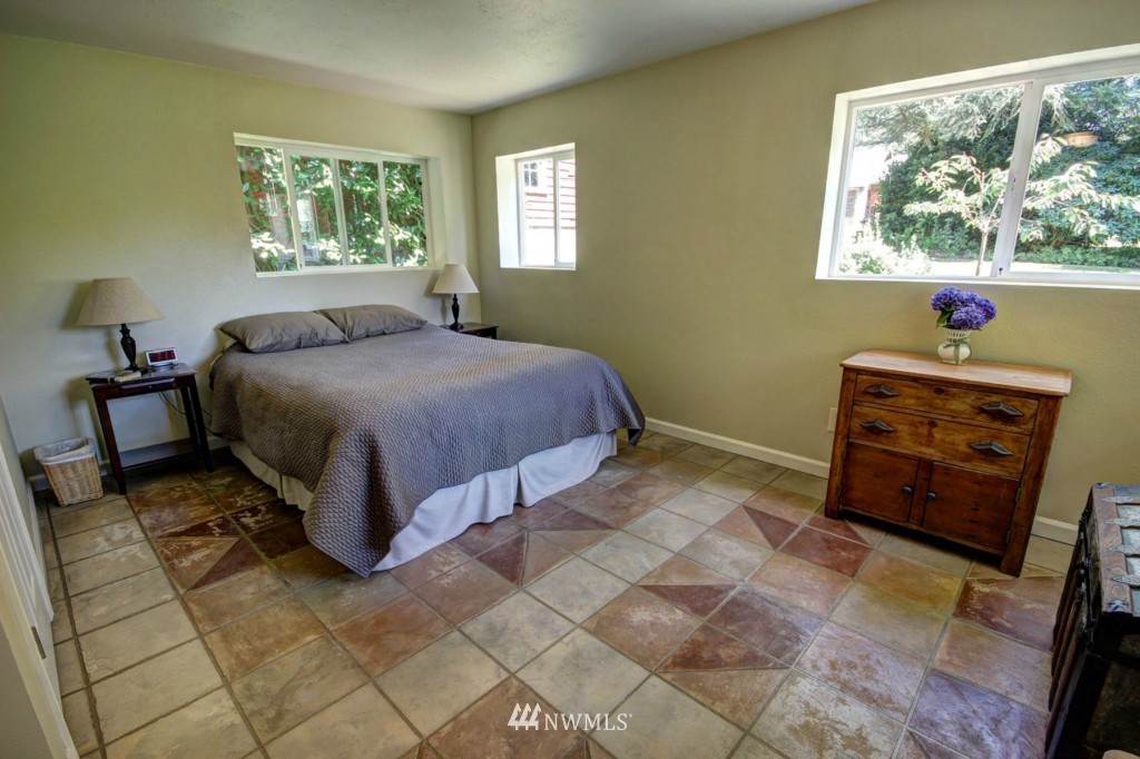 6294 Mission Road Bellingham, WA 98226 - Photo 10 of 25 a spacious bedroom with a bed and a window