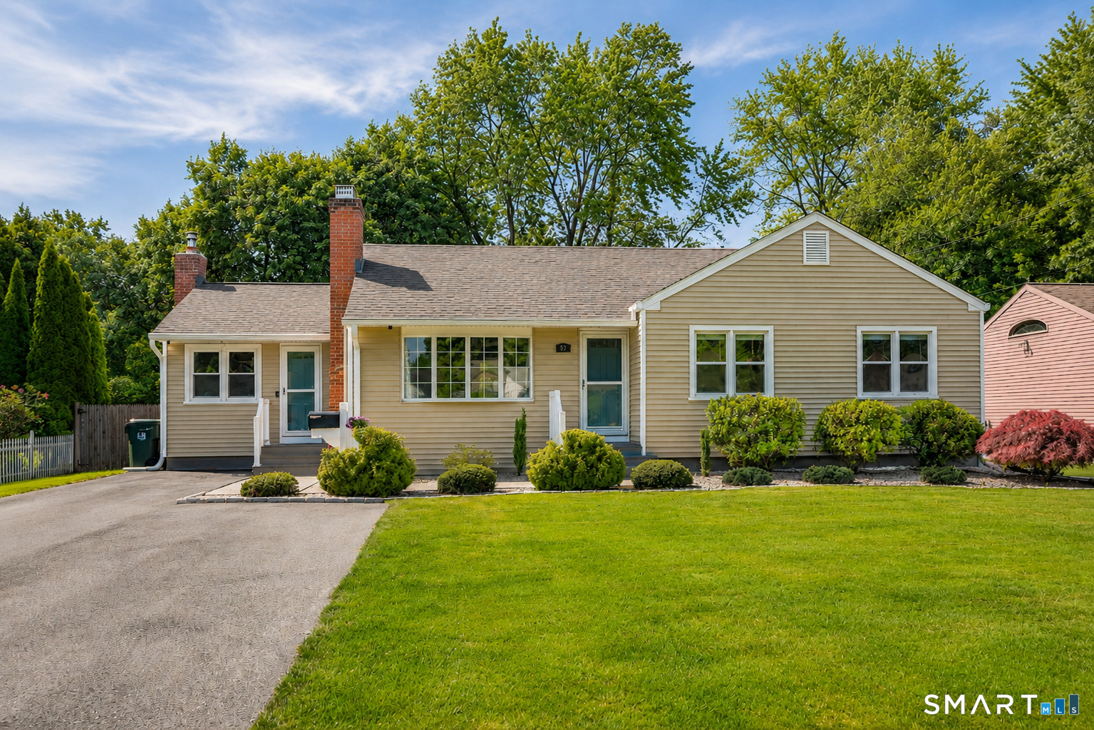 87 Lydall Road Newington, CT 06111 - Photo 3 of 35 a front view of a house with a yard and trees