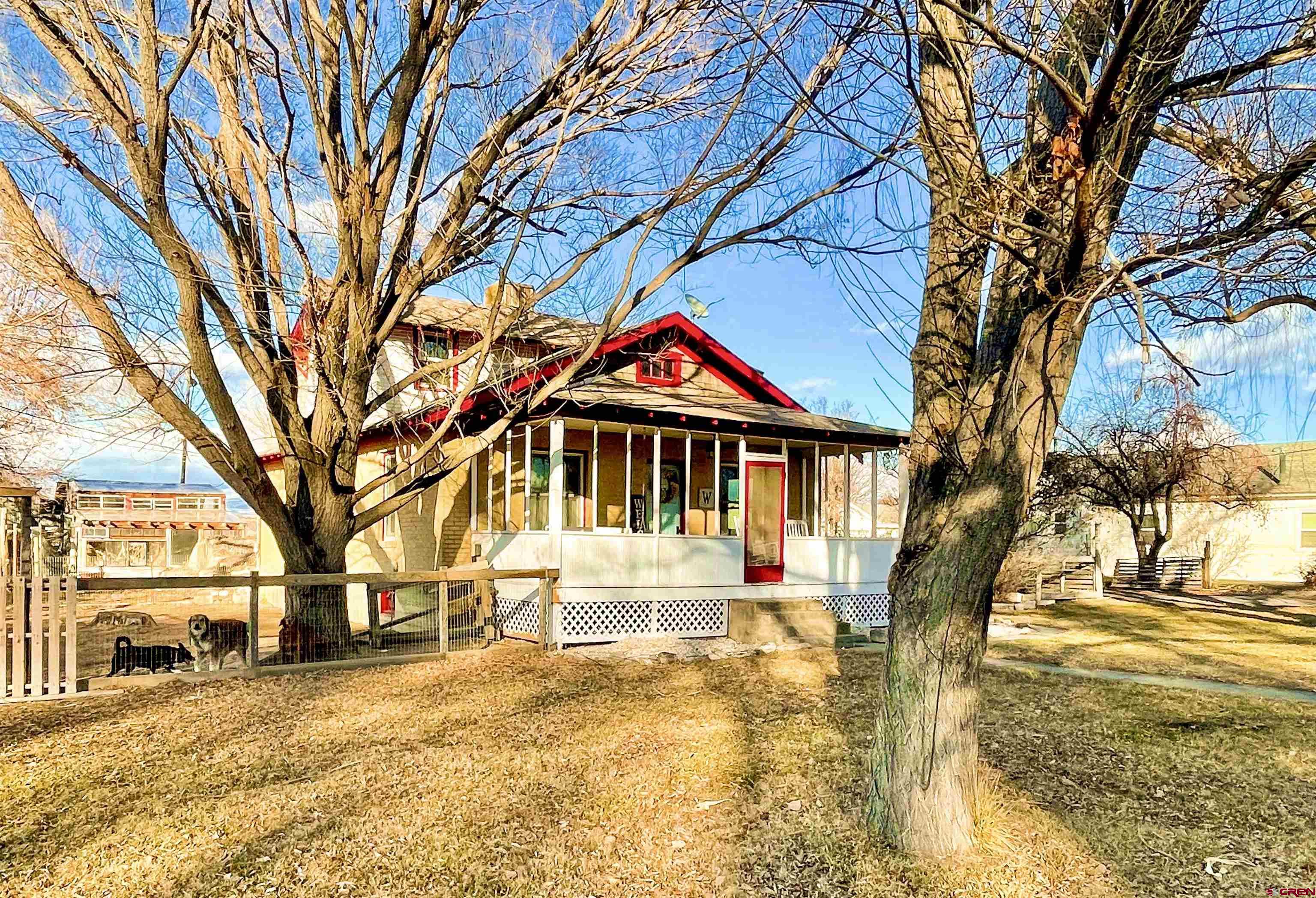19643 H Road Delta, CO 81416 - Photo 2 of 35 a front view of a house with a yard covered with snow