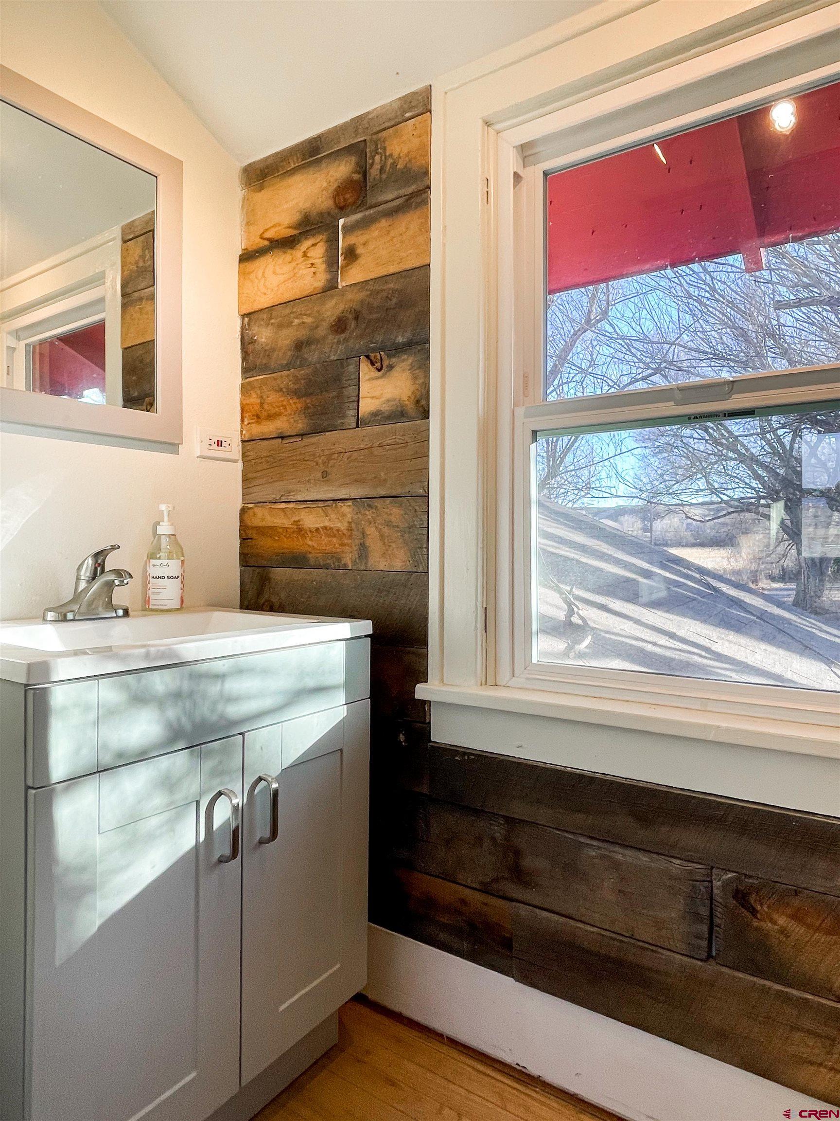 19643 H Road Delta, CO 81416 - Photo 24 of 35 a bathroom with a sink and a mirror