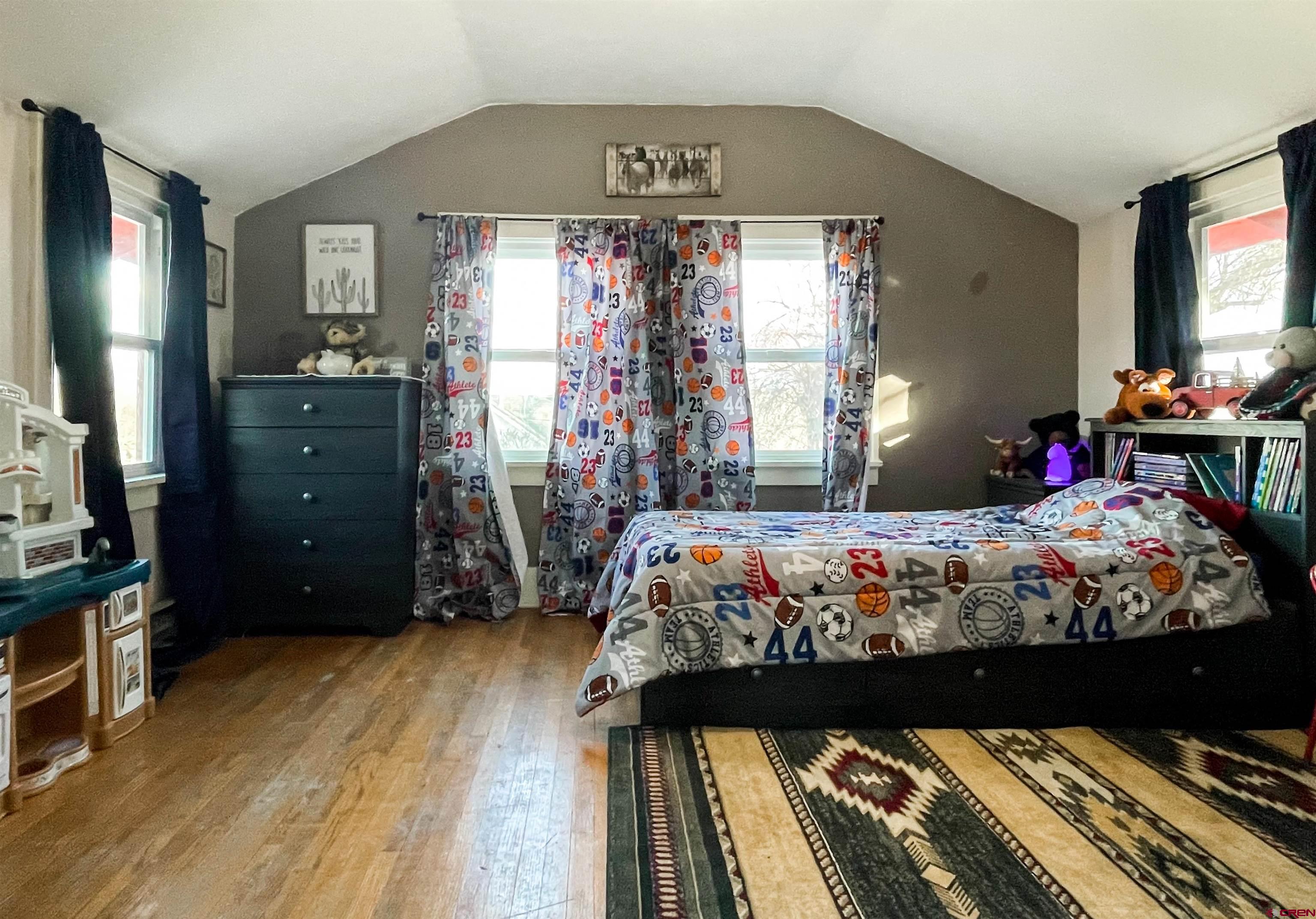 19643 H Road Delta, CO 81416 - Photo 25 of 35 a bed sitting in a bedroom next to a window