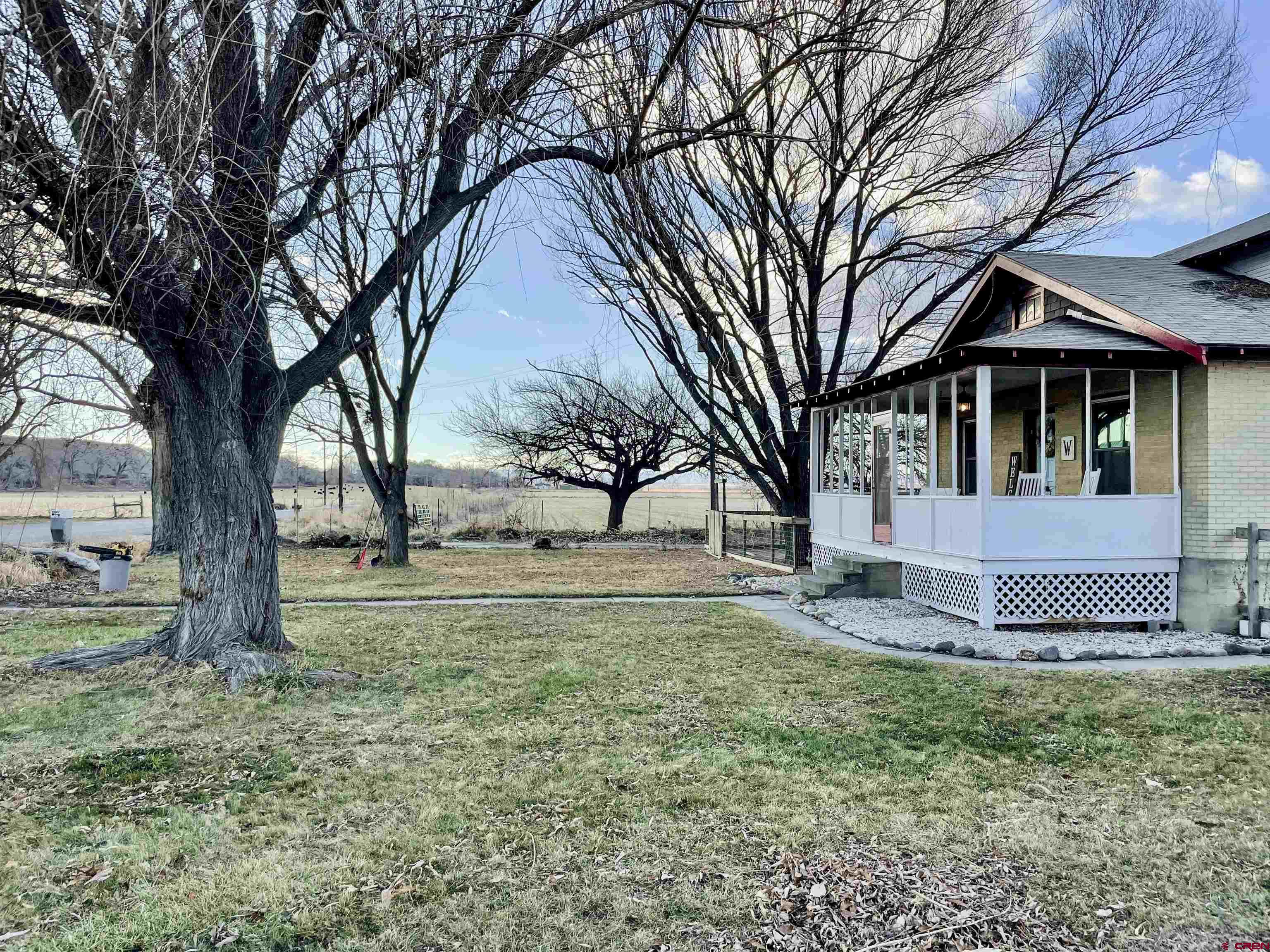19643 H Road Delta, CO 81416 - Photo 26 of 35 a front view of a house with a yard