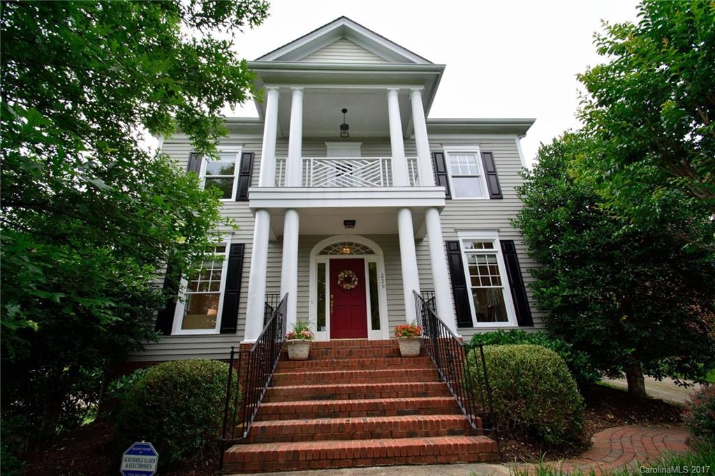 229 Kimberly Road Davidson, NC 28036 - Photo 1 of 23 a front view of a house with a garden