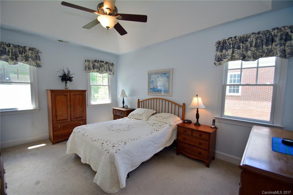 229 Kimberly Road Davidson, NC 28036 - Photo 8 of 23 a bedroom with a bed and a window