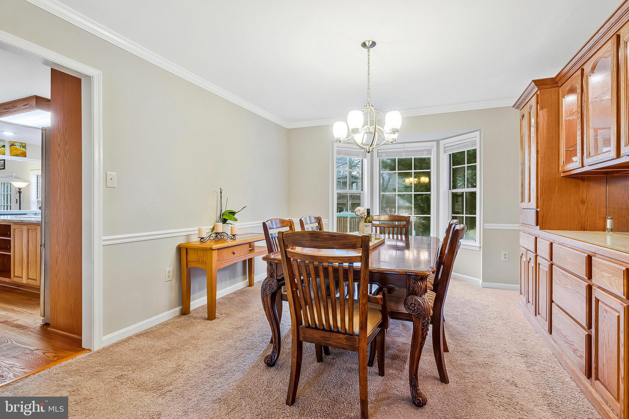 1545 Kingstream Circle Herndon, VA 20170 - Photo 12 of 71 a view of a dining room with furniture window and wooden floor