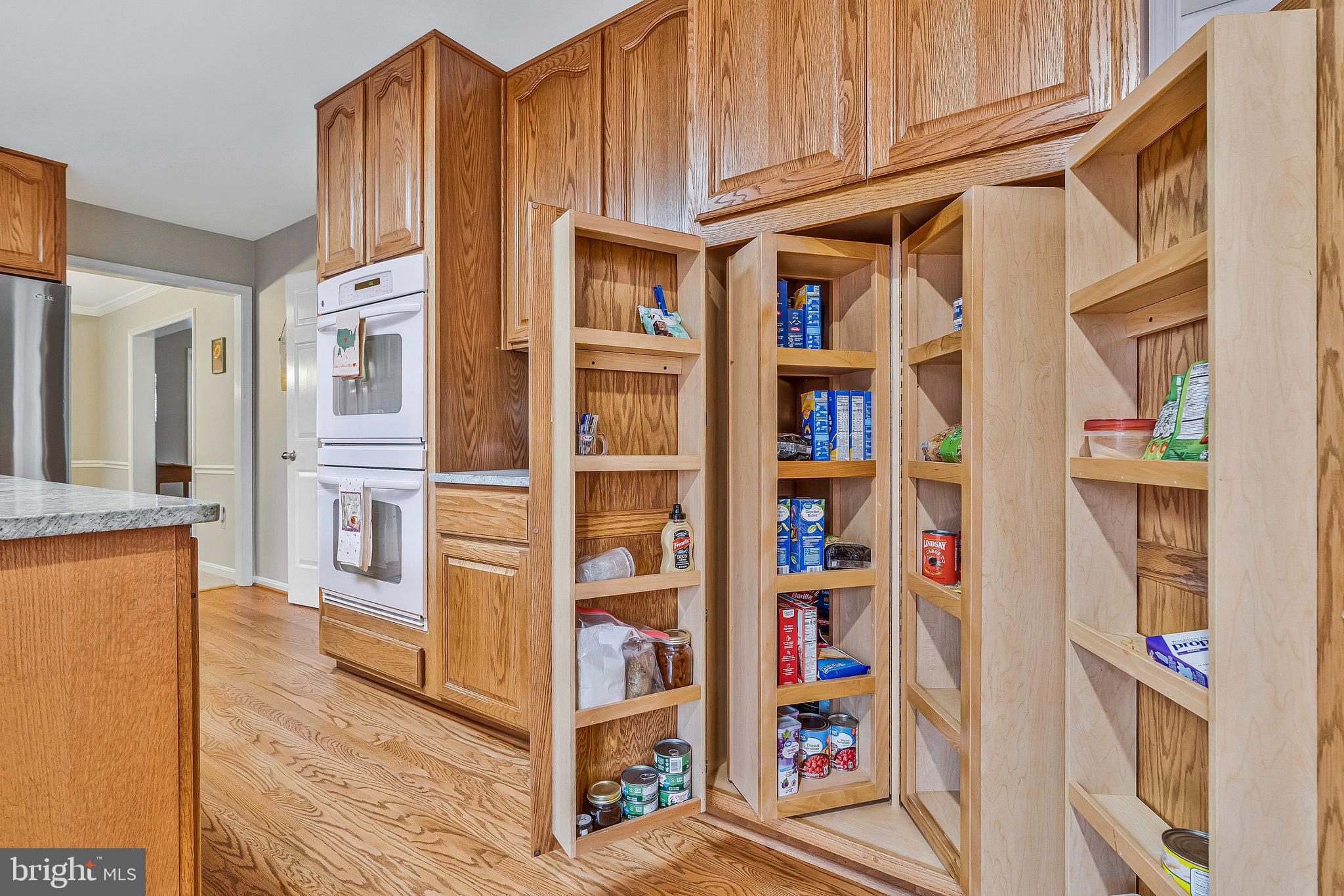 1545 Kingstream Circle Herndon, VA 20170 - Photo 18 of 71 a view of walk in closet with clothes and shoes