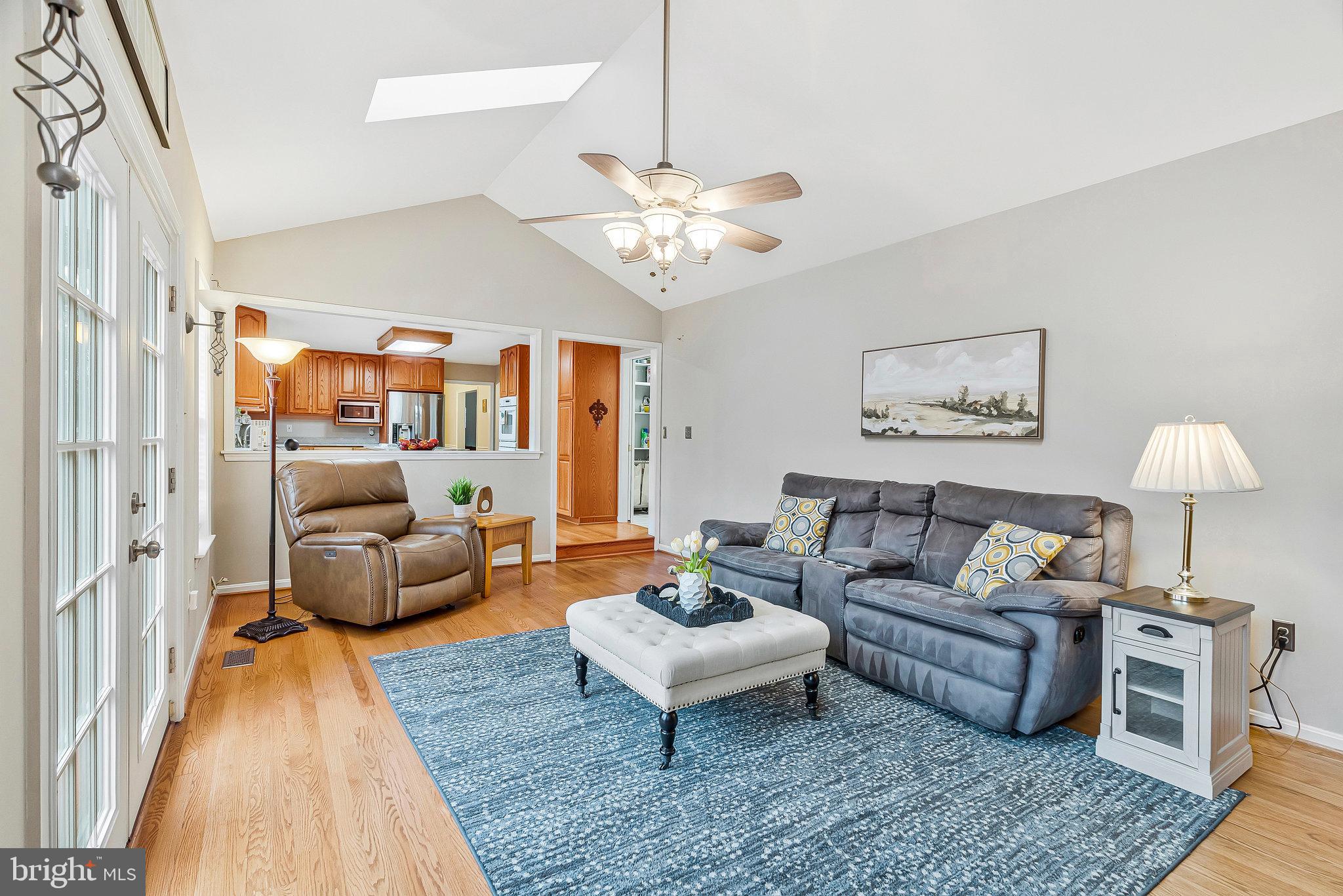 1545 Kingstream Circle Herndon, VA 20170 - Photo 20 of 71 a living room with furniture and a chandelier