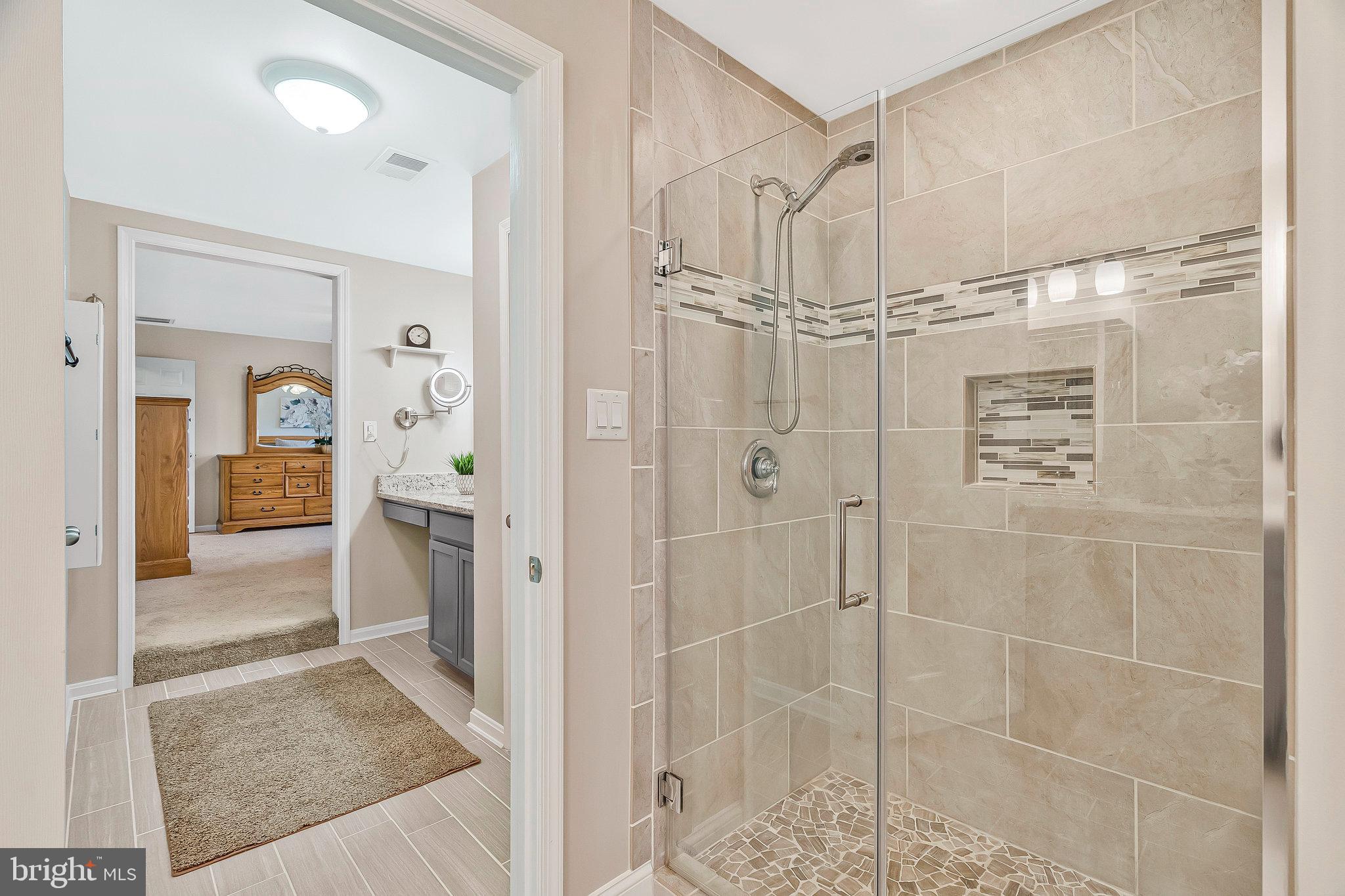1545 Kingstream Circle Herndon, VA 20170 - Photo 32 of 71 a bathroom with a glass shower door