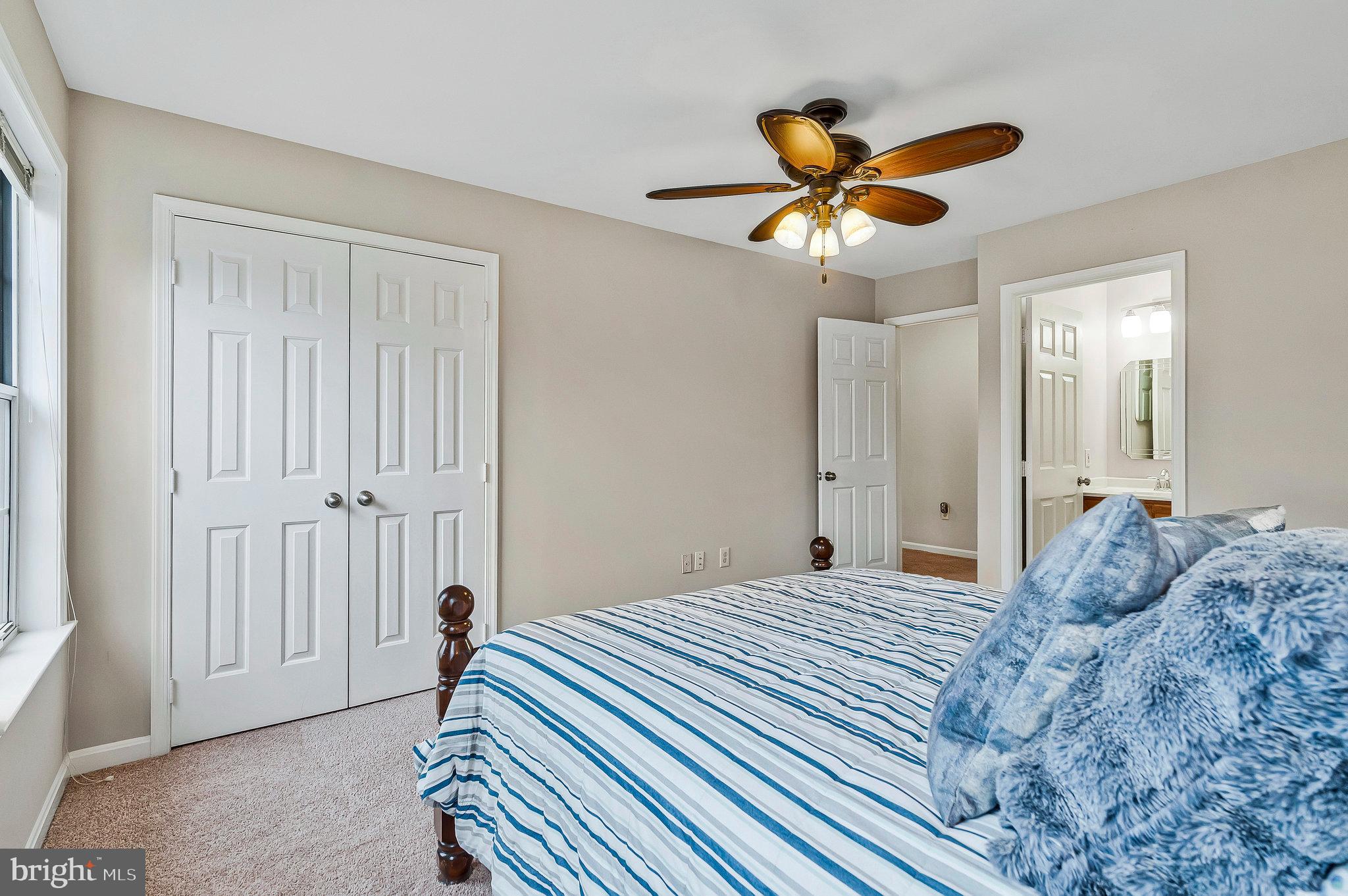 1545 Kingstream Circle Herndon, VA 20170 - Photo 35 of 71 a bedroom with a bed and a chandelier
