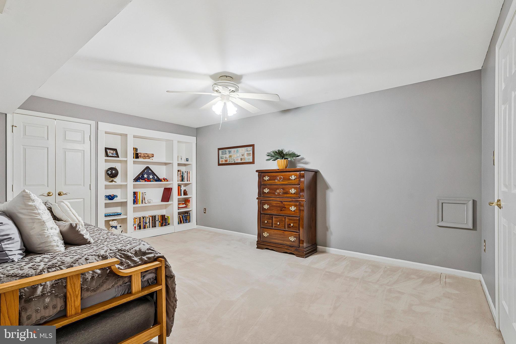 1545 Kingstream Circle Herndon, VA 20170 - Photo 50 of 71 a bedroom with a bed and a chandelier