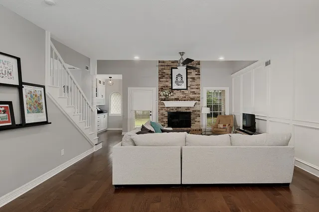 a living room with furniture and a fireplace