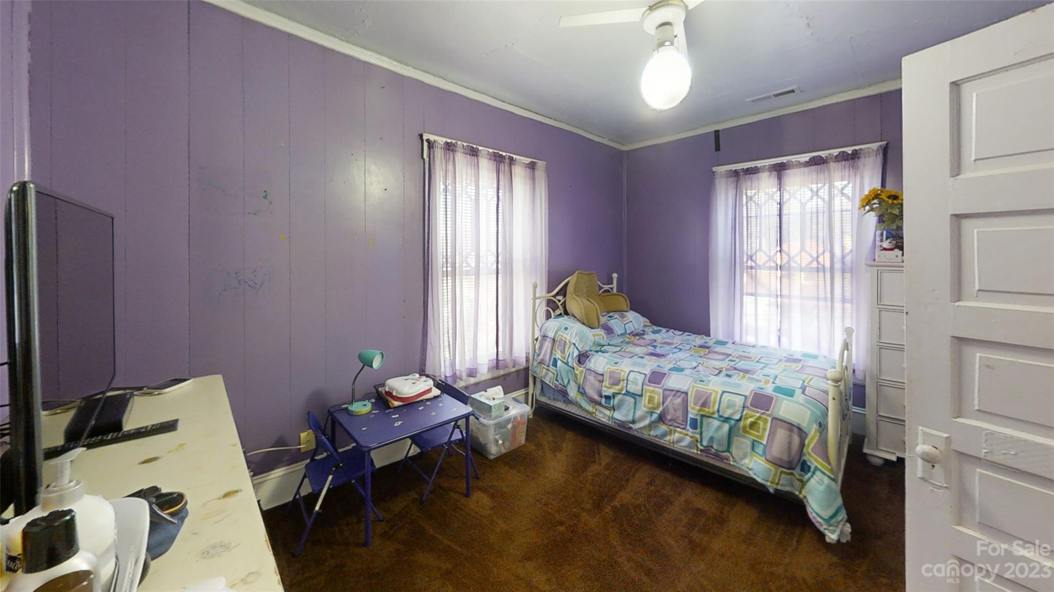 182 Flint Street Asheville, NC 28801 - Photo 18 of 22 a bedroom with a bed and wooden floor