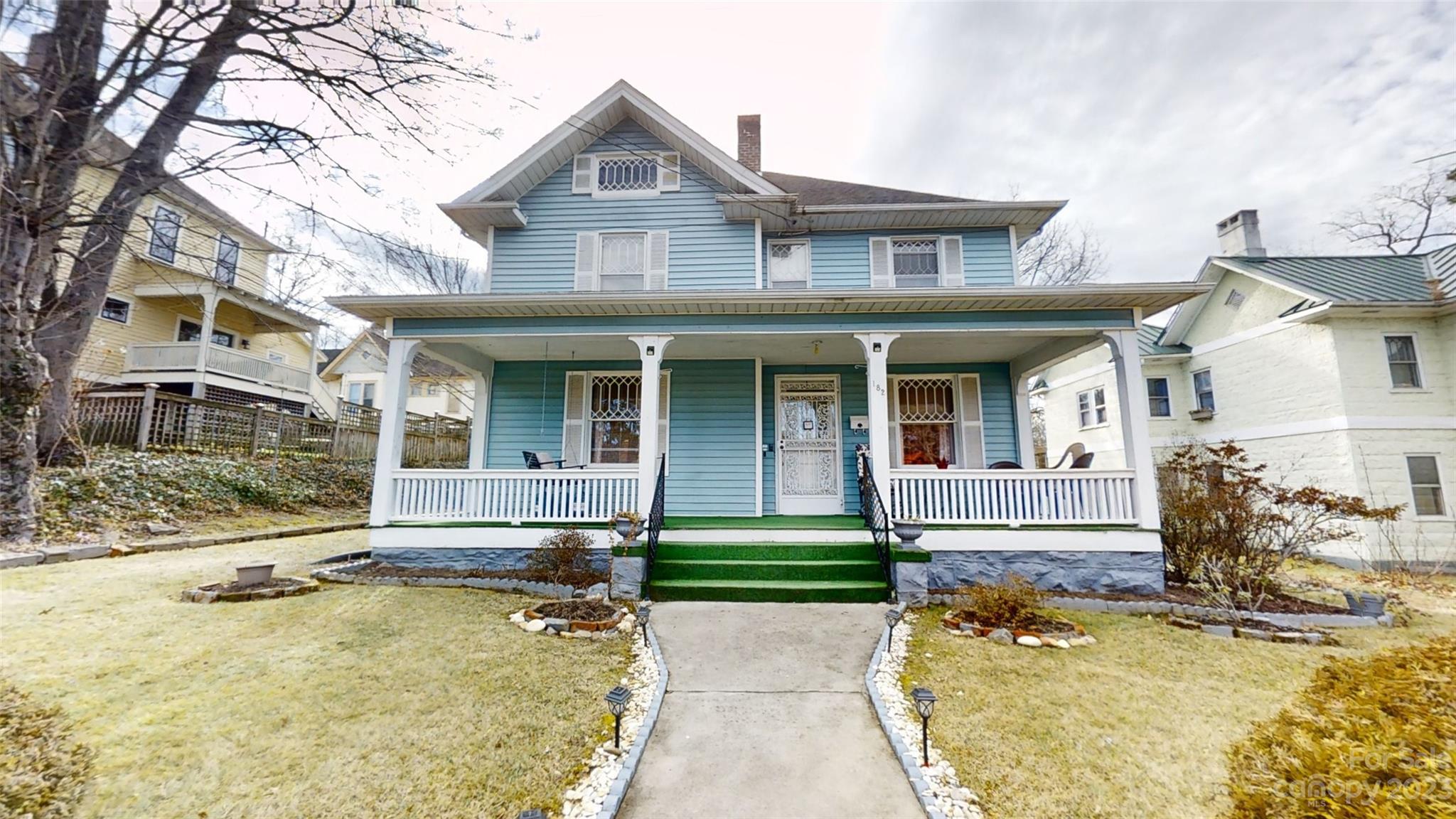 182 Flint Street Asheville, NC 28801 - Photo 4 of 22 front view of a house with a yard