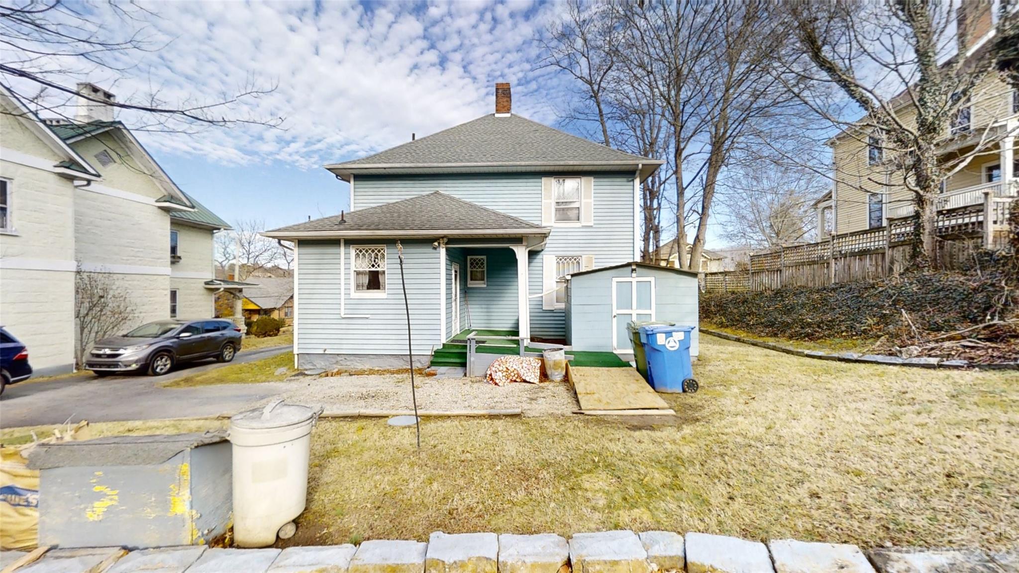 182 Flint Street Asheville, NC 28801 - Photo 6 of 22 a front view of a house with garden