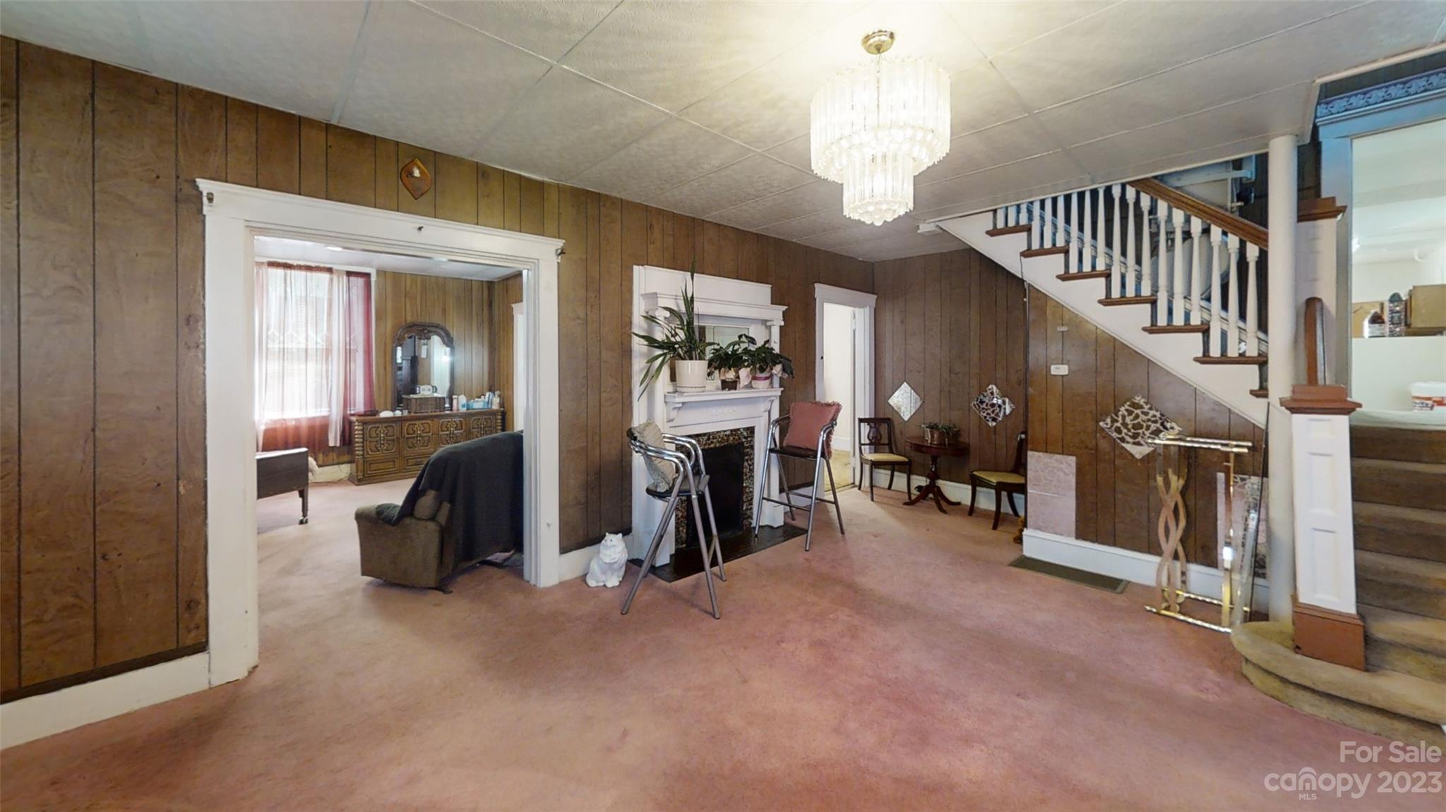 182 Flint Street Asheville, NC 28801 - Photo 8 of 22 a view of a livingroom with entryway and staircase