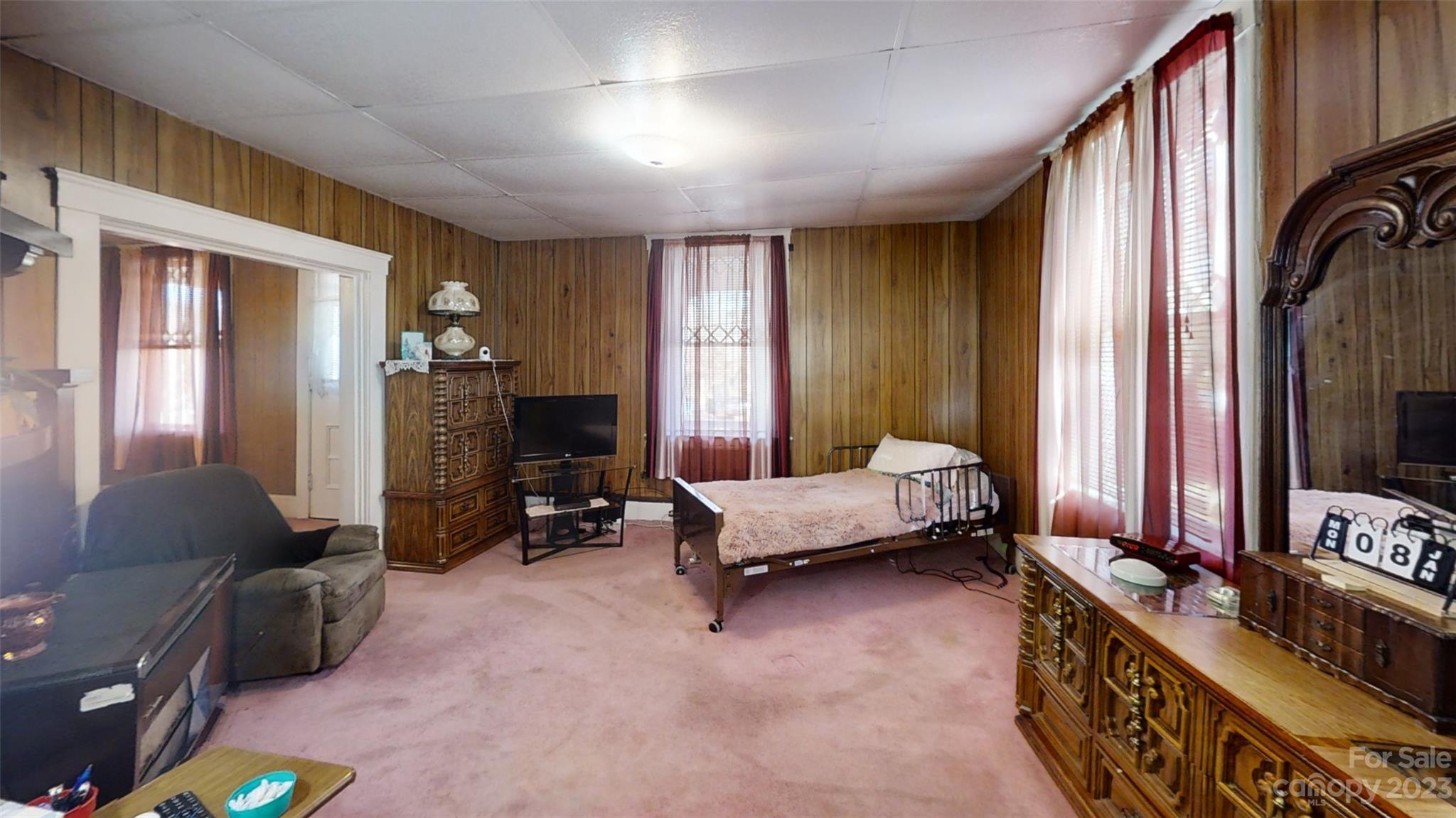182 Flint Street Asheville, NC 28801 - Photo 10 of 22 a living room with furniture and a flat screen tv