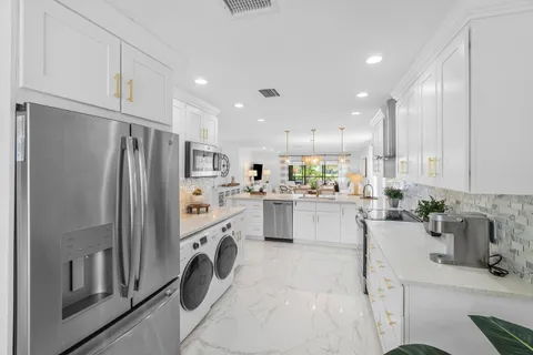 a kitchen with sink and window