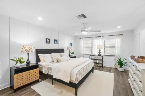 a bedroom with a bed and a dresser