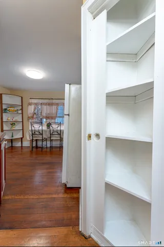 a view of a livingroom with furniture and wooden floor