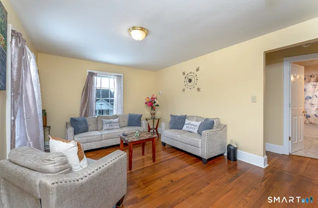 a living room with furniture and a window
