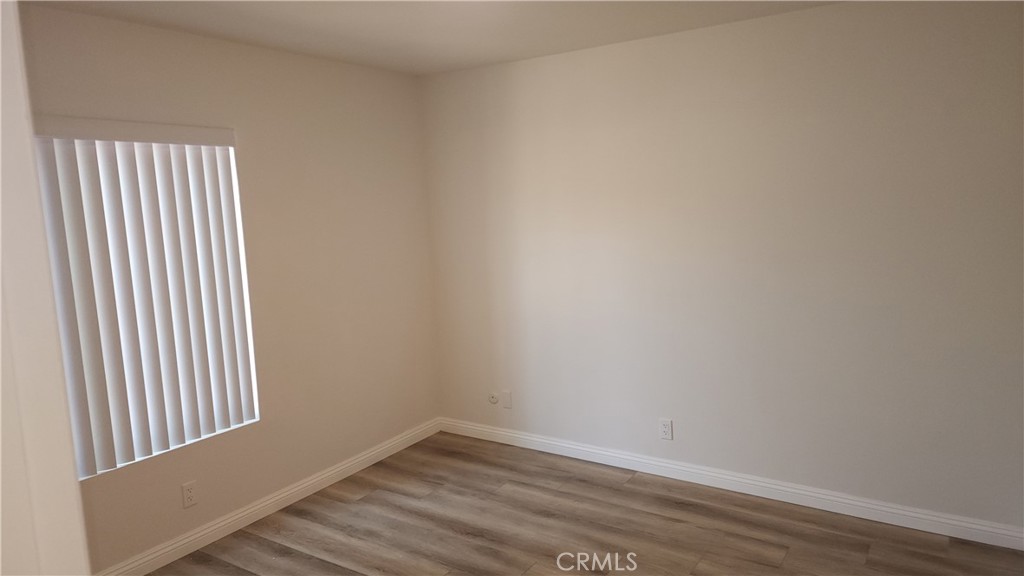 1617 Sunset Lane Fullerton, CA 92833 - Photo 11 of 18 a view of a small space with wooden floor and a window